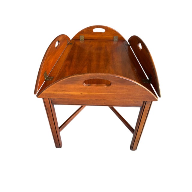 Quick Hits: • Vintage butler tray table • Warm mahogany finish • Hinged drop-leaf sides • 1970s • American traditional •...