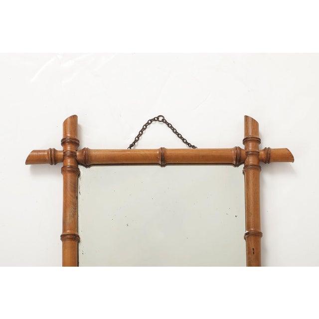 This charming early 20th-century English mirror features a finely carved faux bamboo frame with a rich, warm patina that...