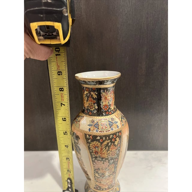 Classic baluster or bottle form with a graceful flared neck and stable footed base. The entire surface is meticulously...