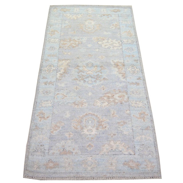 Hand-knotted with care using traditional rug-making techniques, this wool rug blends timeless craftsmanship with a modern...