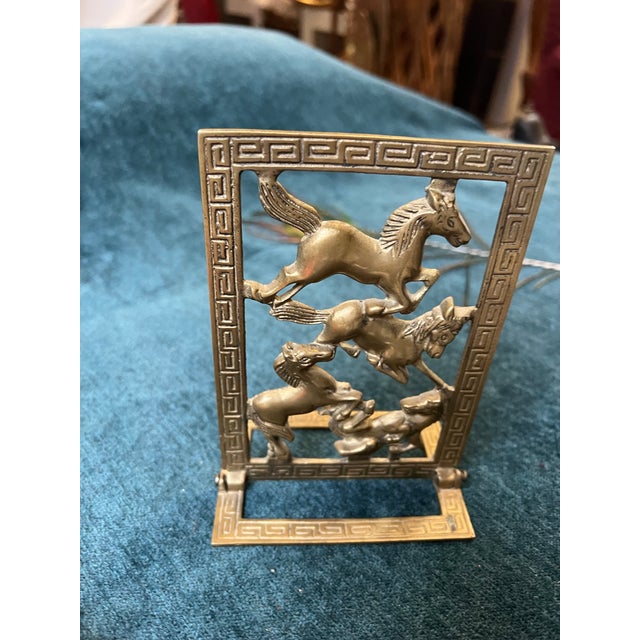 Up for consideration is a beautiful vintage brass equestrian bookend with Greek key accents. This would look lovely in...