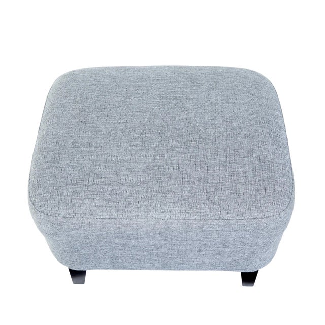 Contemporary scandinavian grace armchair with stool circa 2004. Elegant piece of scandinavian design. Shaped wing back...