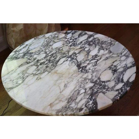 Stunning round Italian marble top Cocktail or Coffee Table with a patinated finished base, measures Approximately 36”...