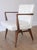 Vintage Jens Risom Model C-108 armchair with walnut wood, original off-white vinyl and exquisitely sculpted arms.