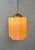 Art Deco pendant lamp. Rose opaline glass with brass fixture. Total length: 80cm. Diameter: 20cm. Height of sconce...