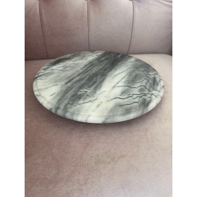 Vintage natural gray-white marble serving tray with unique gray veining. The tray rotates smoothly on a solid marble base....