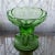 Striking Art Deco-style uranium glass compote featuring a sculptural figural design of nude female forms in a frosted...