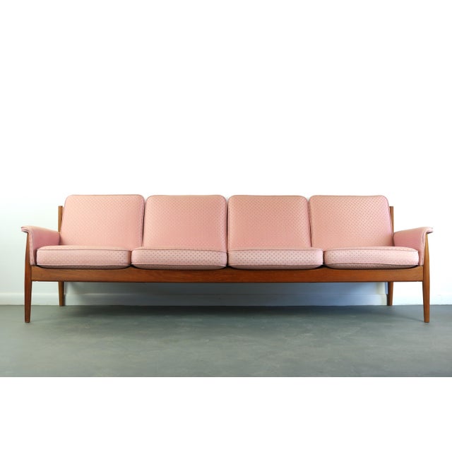 An especially rare, extra-long iteration of Grete Jalk's sculptural sofa for France & Son. This four-seat sofa features...