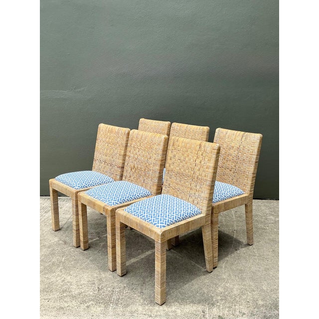 This set of six vintage dining chairs seamlessly blends Mid-Century Modern silhouettes with the organic warmth of Coastal...