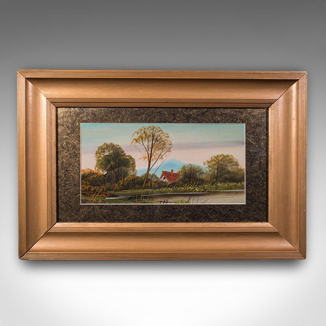 This is a vintage landscape painting. A Scottish, framed oil on board unattributed riverbank scene, dating to the late...