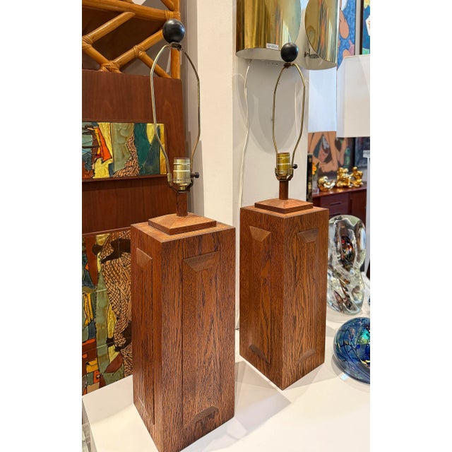 $650per set Mid-century Modern Cross Cut Oak Wood Table Lamps, Pair Offered for sale is a pair of Mid-century modern wood...