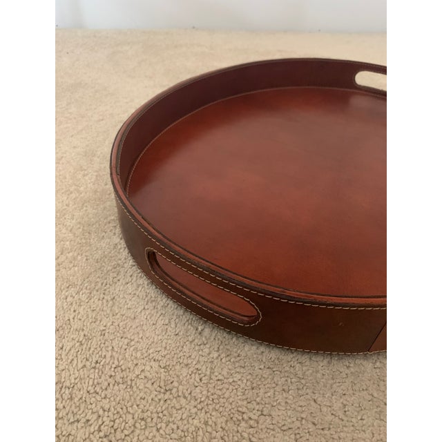 High Quality leather tray in Luggage color with inset handles and grey linen backing. It is top stitched around the inside...