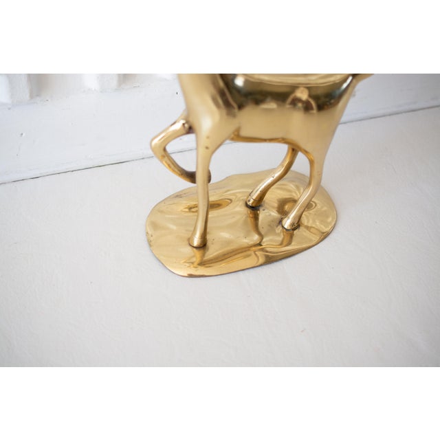 This listing is for an oversized, vintage, polished, solid brass deer candle holder. It holds 6 candles which look to be...