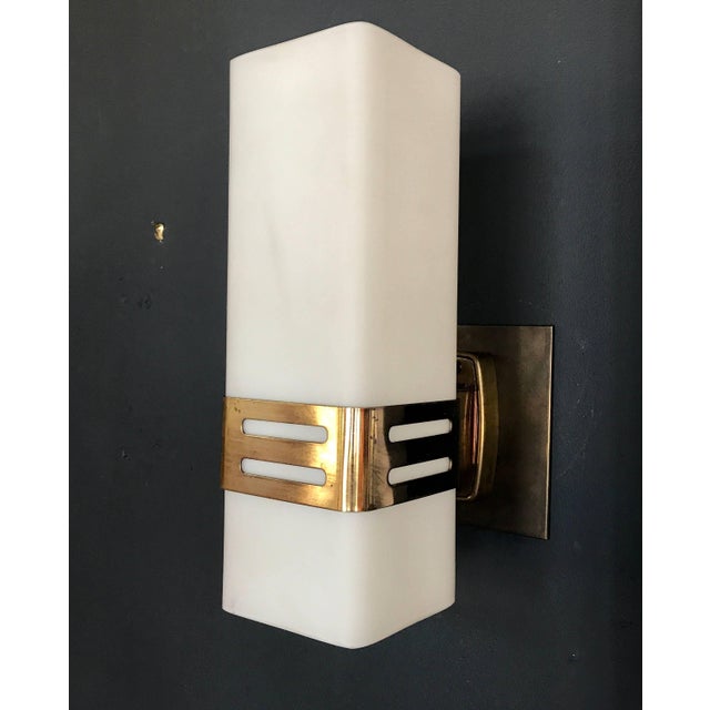 Stilnovo single sconce in opaline glass and brass band, 1950s.
