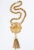 This is part of Chairish’s Costume Jewelry assortment. 1960s goldtone shield medallion necklace with large tassel and...