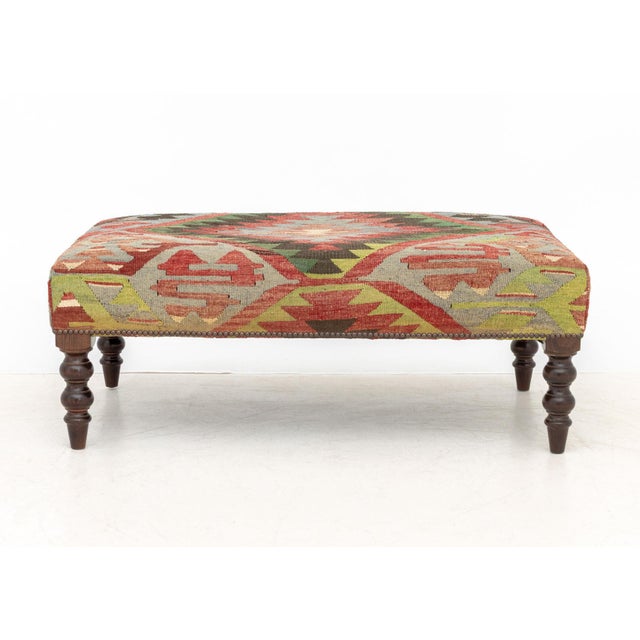 George Smith Kilim Upholstered Ottoman, maker's plaque label underneath. 16" H x 41" W x 24" D. Provenance: From a Forest...