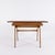An outstanding example of French post-war furniture design: This rare teak and oak desk is attributed to the leading...