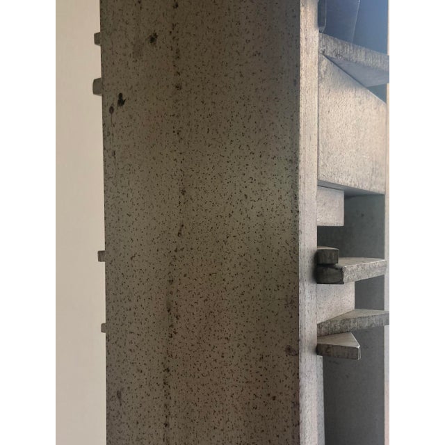 This very tall and slim sculpture painted in silver is a study or prototype for the monument 'La Fugue du Bugey' which was...