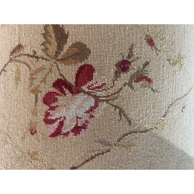 Charming vintage rectangular ottoman featuring floral needlepoint-style upholstery in muted beige, burgundy, blue, pink...