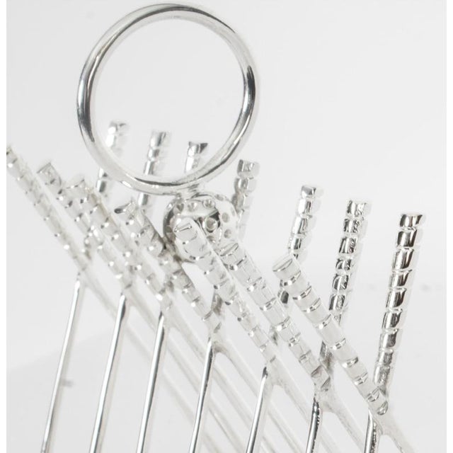 This is a delightful Vintage silver plated toast rack, also ideal for letters, dating from the second half of 20th...