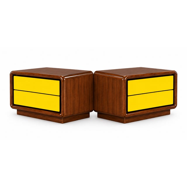 A striking pair of 1980s Postmodern nightstands, combining sculptural form with a bold use of color. Each case features a...