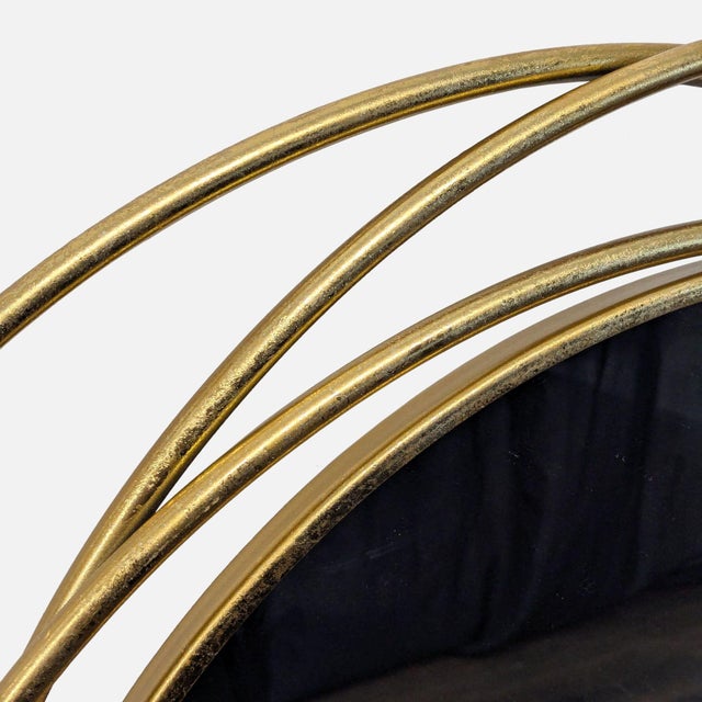 Crafted from iron, reflective glass, and MDF backing, this wall mirror has a polished gold metal finish. Brand: UMA...