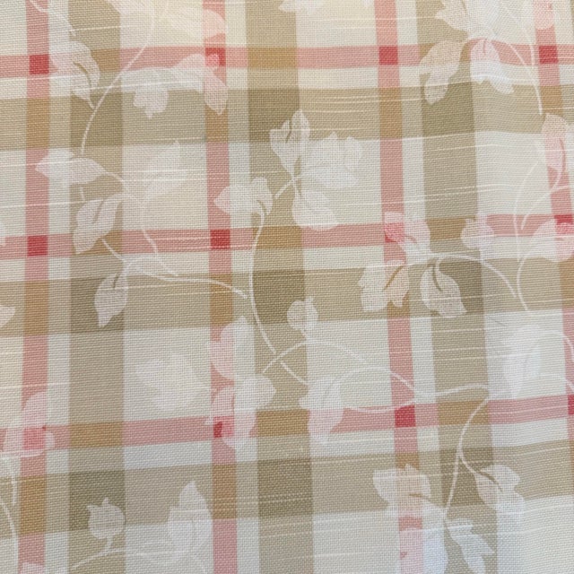 A soft, layered windowpane plaid with an overlaid foliage scroll, this vintage P Kaufmann fabric offers a muted, collected...