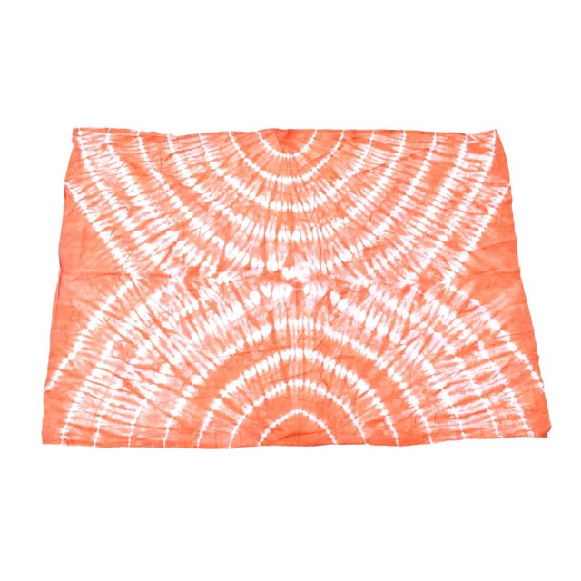 Starch resist, a time-honored dyeing method in Yoruba tie-dye fabric production, involves applying a starch paste onto...