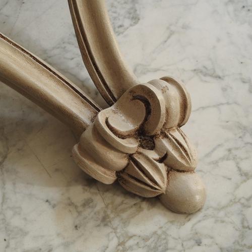 Compact wall console in a curved shape with a patinated surface. Its design is inspired by classic console forms of the...