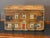 A 19th C. English pine box hand-painted as a Georgian country house, the dovetailed front with sash windows hung with...