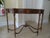 Evoking the graceful proportions of the Late Georgian period, the Nathan Console Table is crafted in richly figured crotch...