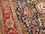 circa 1900 Antique Persian Heriz Serapi Rug. The dark navy/black field and red border stand out on this stellar piece....