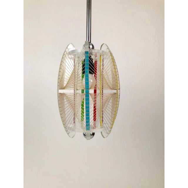 This unique acrylic and mono filament, pendant lamp comes from the Czech Republic. Made in the 1950s, the details are what...