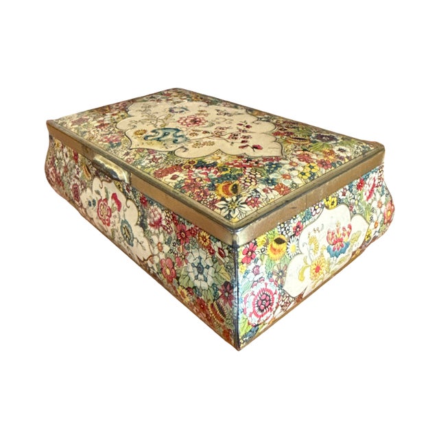 A beautifully decorated vintage candy or biscuit box made in Holland, featuring a richly detailed all-over floral design...
