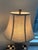 Pair of Uttermost table lamps with carved wood bases and included shades. These have an antique-inspired, sculptural look...