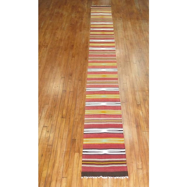 Rare narrow and long striped Kilim runner. 1'9'' x 16'11''