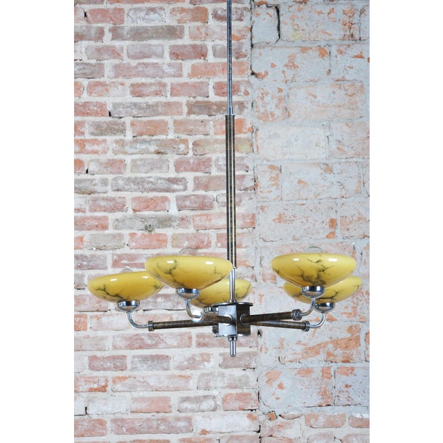 This magnificent five-arm chandelier originating from the 1920s represents an exceptional example of interwar design in...