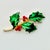 A lovely Christmas Brooch from Mylu Designs from the 1950s. It features a green holly branch with red berries and gold...