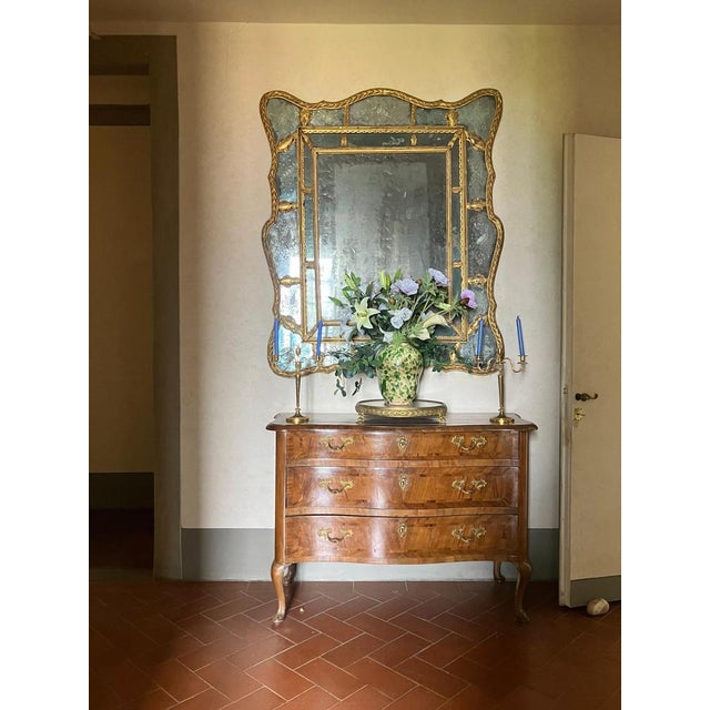 Elegant 18th Century Italian (Tuscan) Louis XV walnut commode, an extraordinary curved chest of drawers featuring...