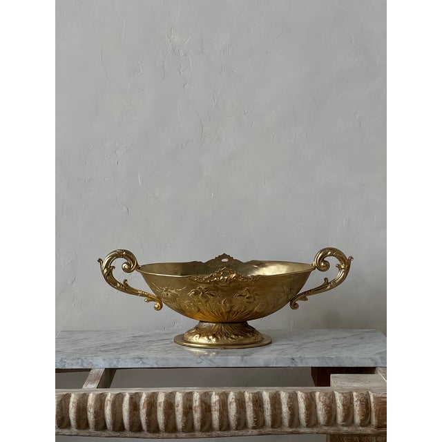Fantastic large double handled, footed bowl with elegant form and decoration. This piece is solid bronze with a gold gilt...