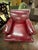 Classic vintage club chair and ottoman upholstered in rich burgundy leather with deep, cushioned comfort and timeless...