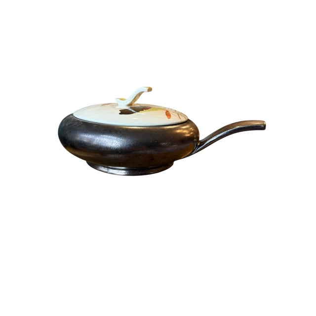 Offering a 1950’s vintage Red Wing Lotus Bronze covered casserole dish. The entire Lotus line was officially discontinued...