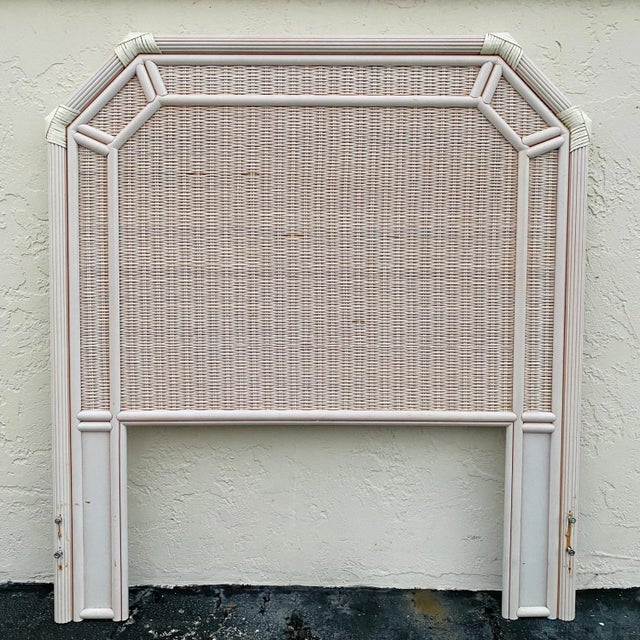 One twin size headboard is in good vintage condition with scuffs and some broken rattan pieces from normal wear and age....