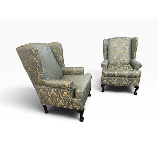 Add timeless elegance to your space with this pair of vintage upholstered arm chairs, dating to circa 1940s. Each chair...