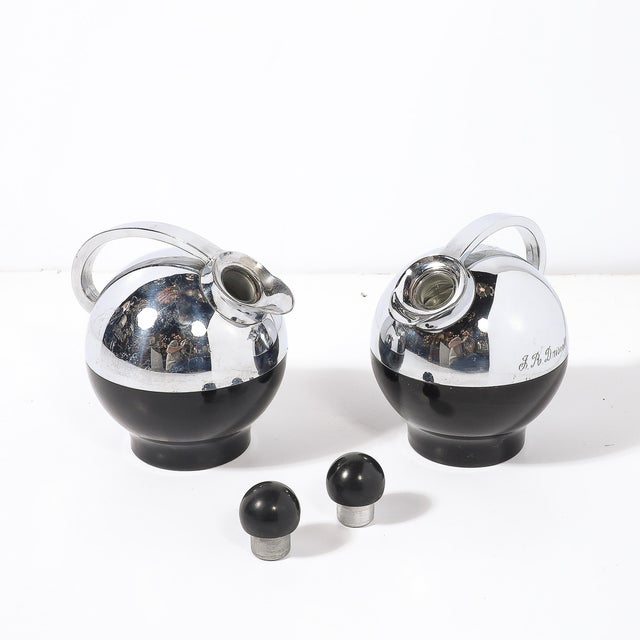 This exceptional pair of Art Deco "Spherical Miracle" thermos bottles, designed by the celebrated industrial designer...