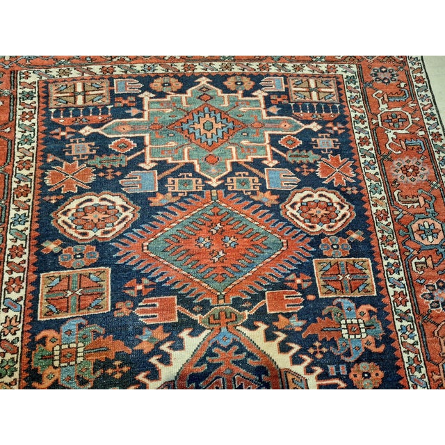 The runner showcases the classic geometric motifs and bold tribal artistry characteristic of Serapi weaving. Hand knotted...