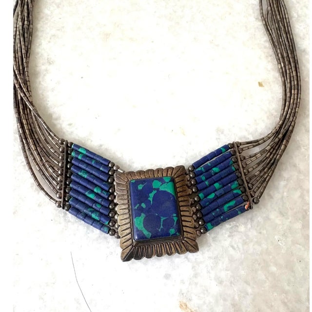 Native American Style multi-strand liquid silver necklace features an azurite-malachite center pendant