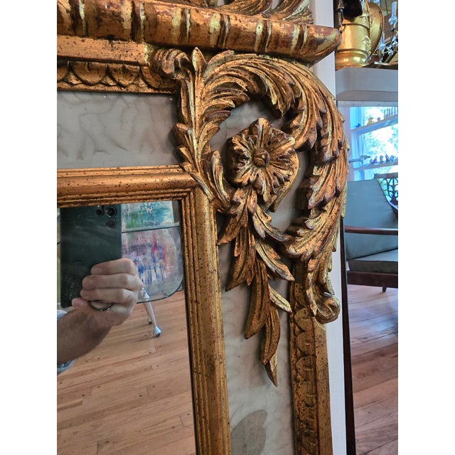 A very fine early mid century era Hollywood Regency glamour Italian gilded mirror. Having non mirrored venetian art glass...