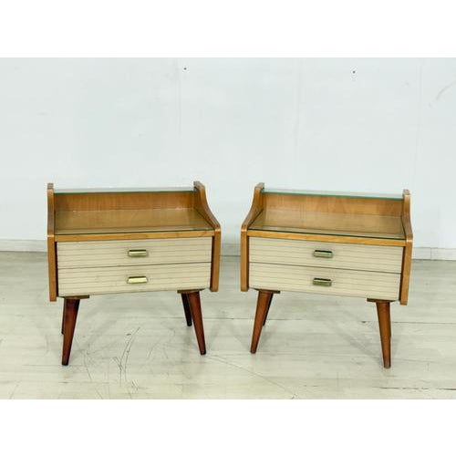 For sale is a set of two vintage bedside tables from the 1960s. These pieces impress with their clean mid-century design,...