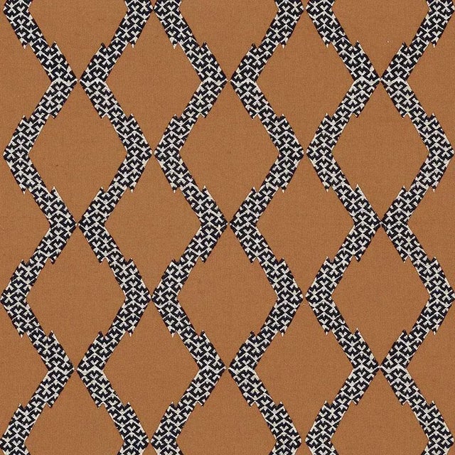 Combining two labor-intensive processes-applique and embroidery-this chicest of the chic design has just a dash of exotic...